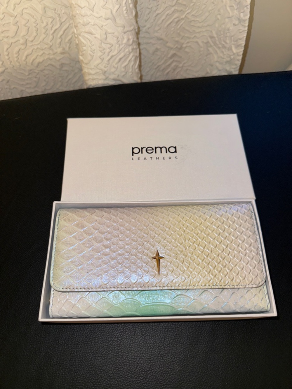 Iridescent White Snake-Embossed Wallet with Gold Cross Accent